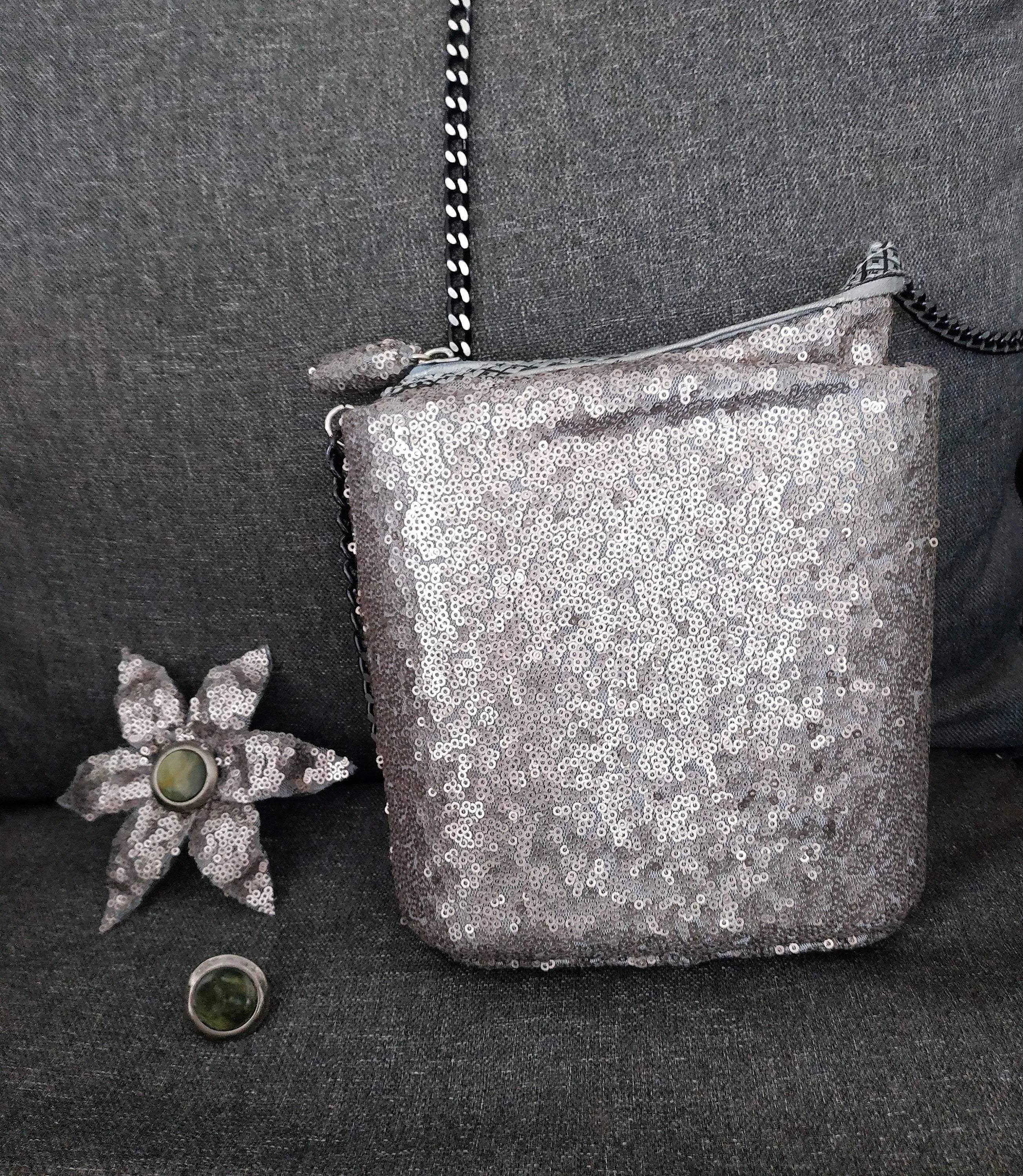 Exclusive handmade silver asymmetric box-bag has sequins on