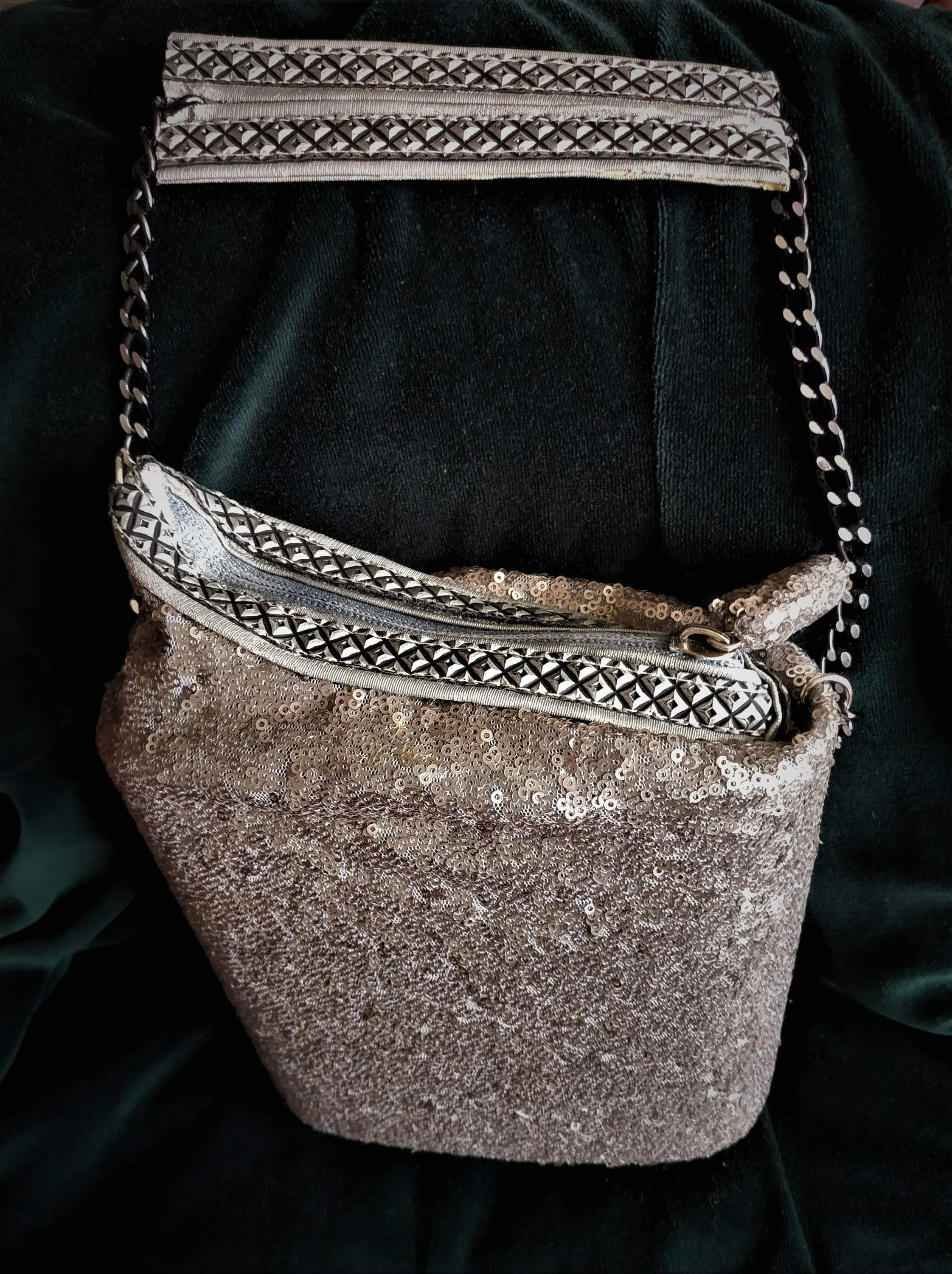 Exclusive handmade silver asymmetric box-bag has sequins on