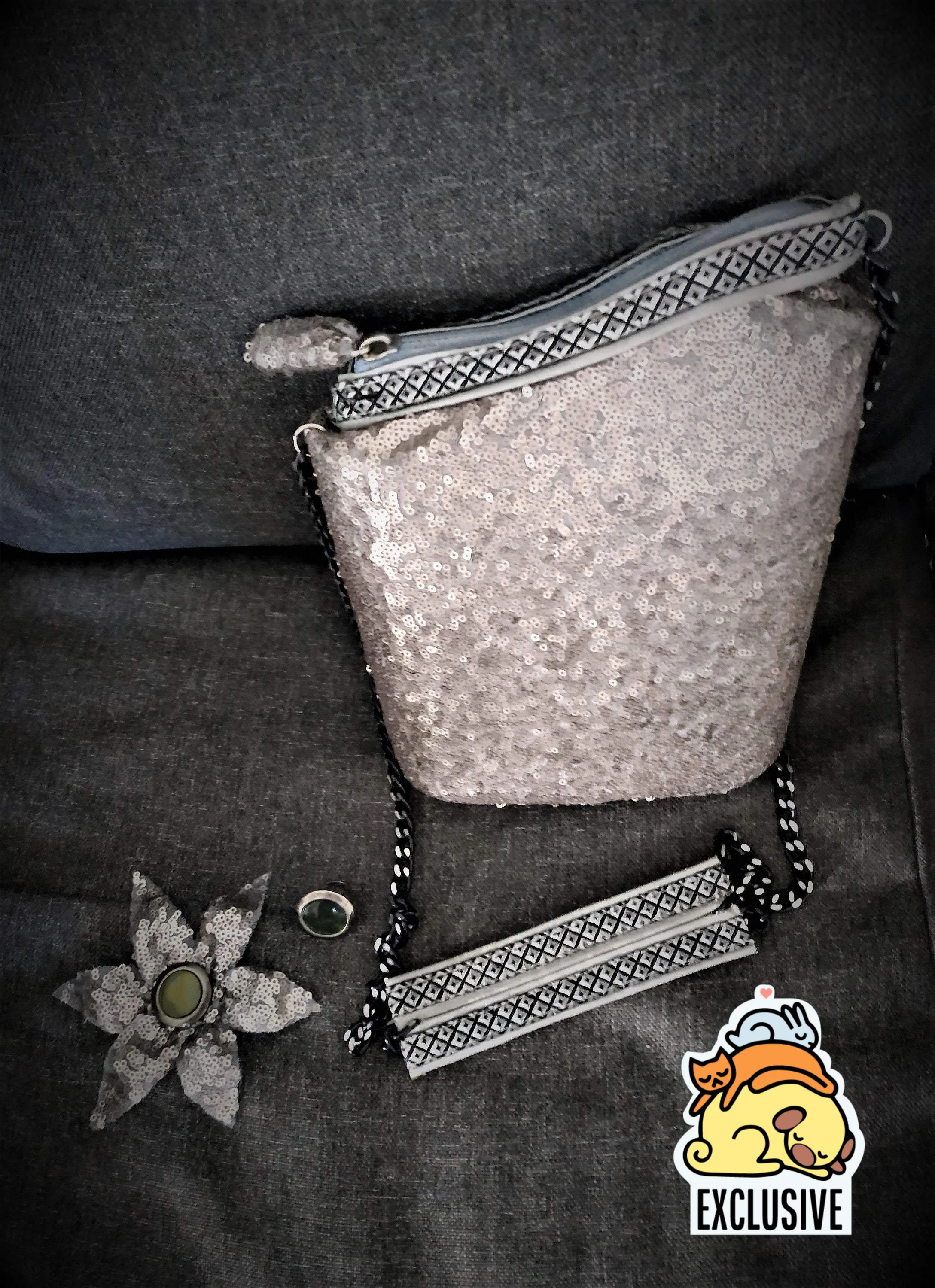 Exclusive handmade silver asymmetric box-bag has sequins on