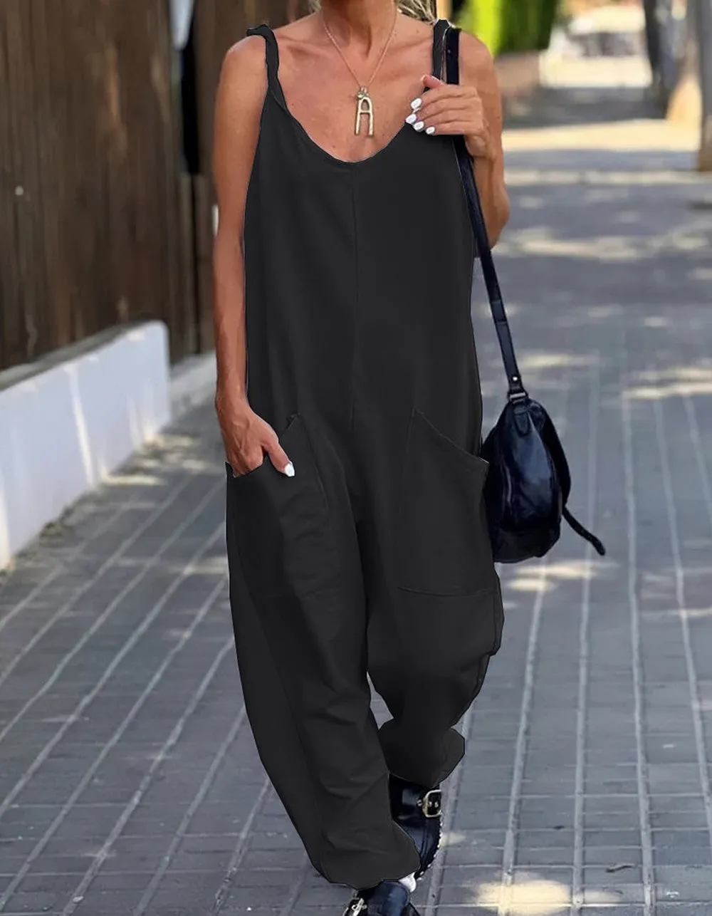 Solid-color Strap Backless Pocket Loose Waist Jumpsuit