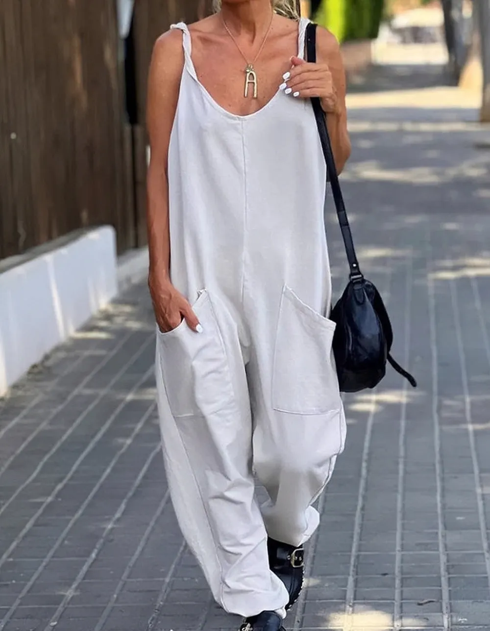 Solid-color Strap Backless Pocket Loose Waist Jumpsuit